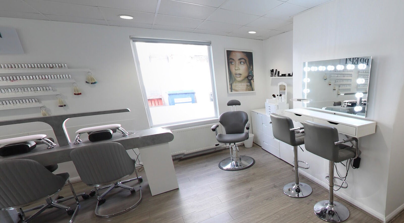 Sleek interior of Prept Romiley in Romiley, England, GB with makeup stations and modern chairs.