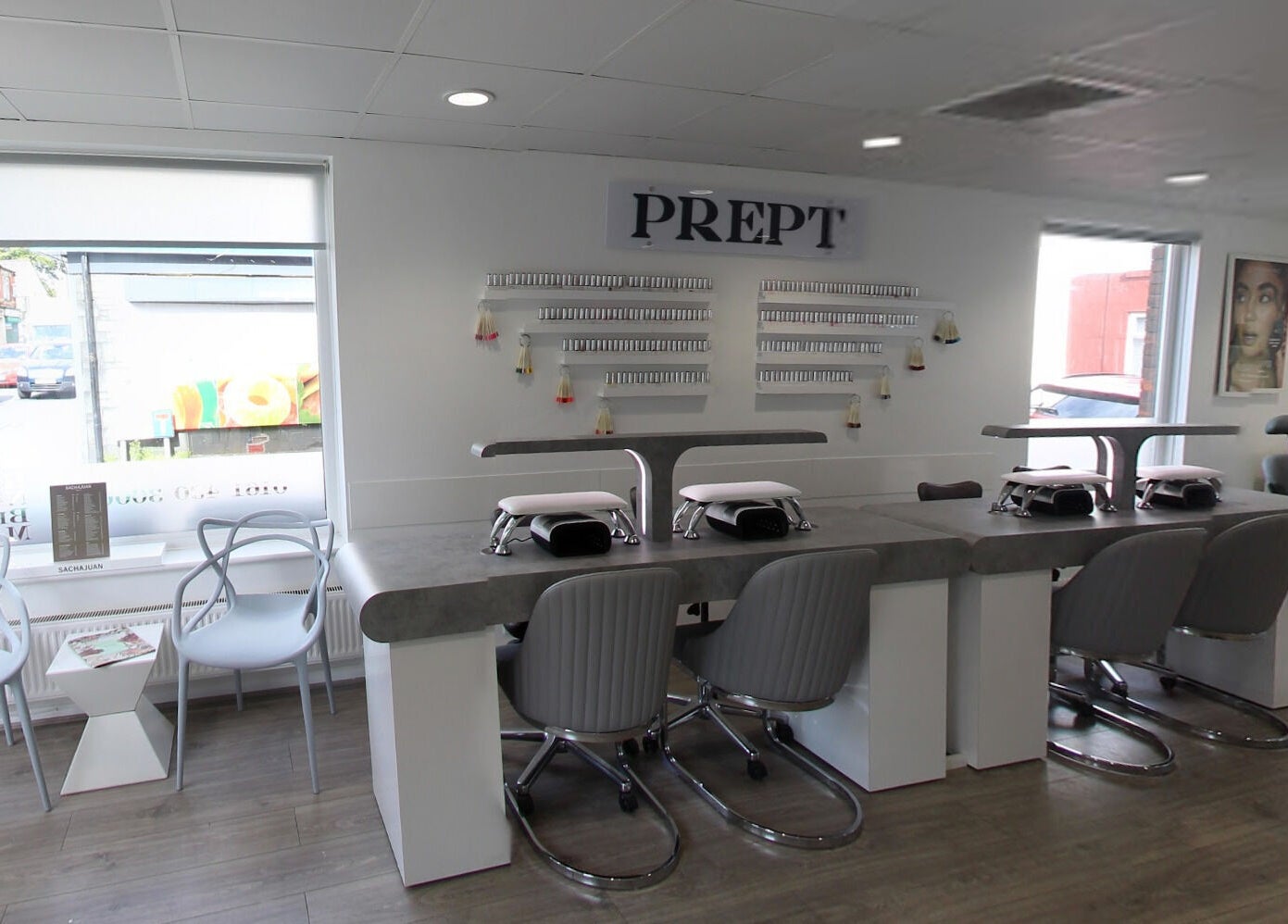 Modern nail salon at Prept Romiley in Romiley, England, GB featuring stylish seating and manicure stations.