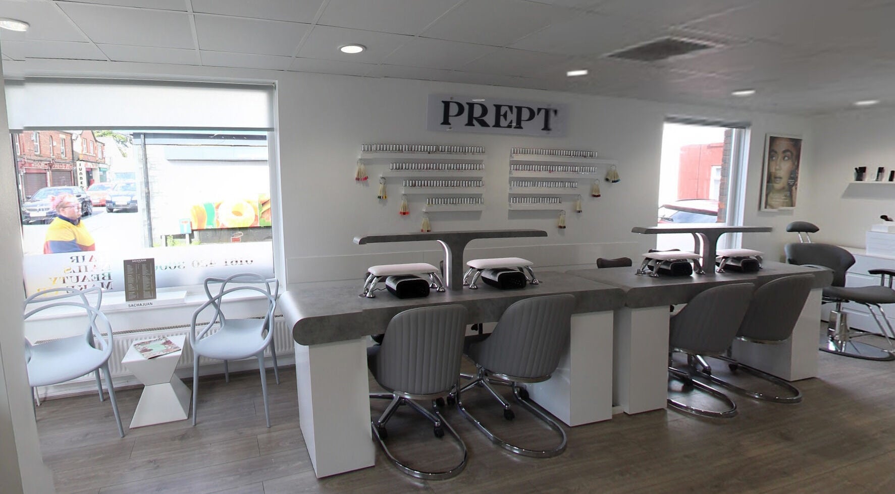 Modern nail salon at Prept Romiley in Romiley, England, GB featuring stylish seating and manicure stations.