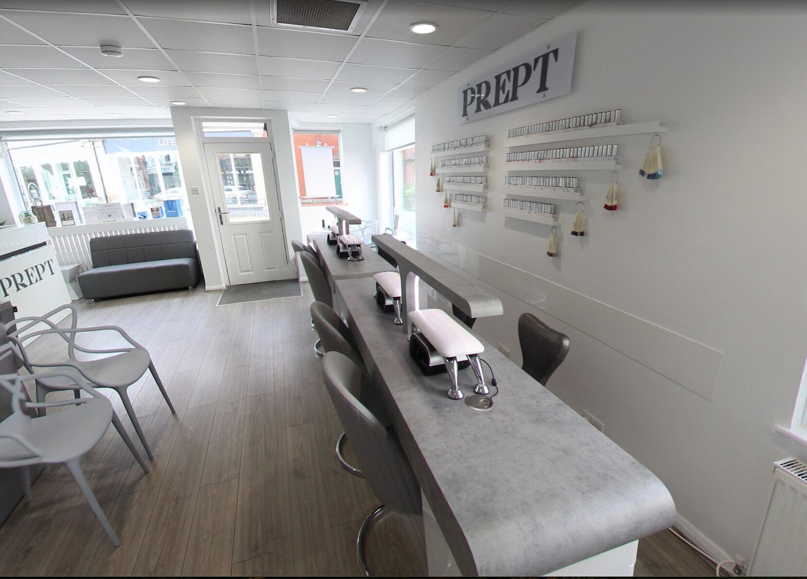 Bright, modern interior of Prept Romiley in Romiley, England, GB showcasing nail stations and seating area.
