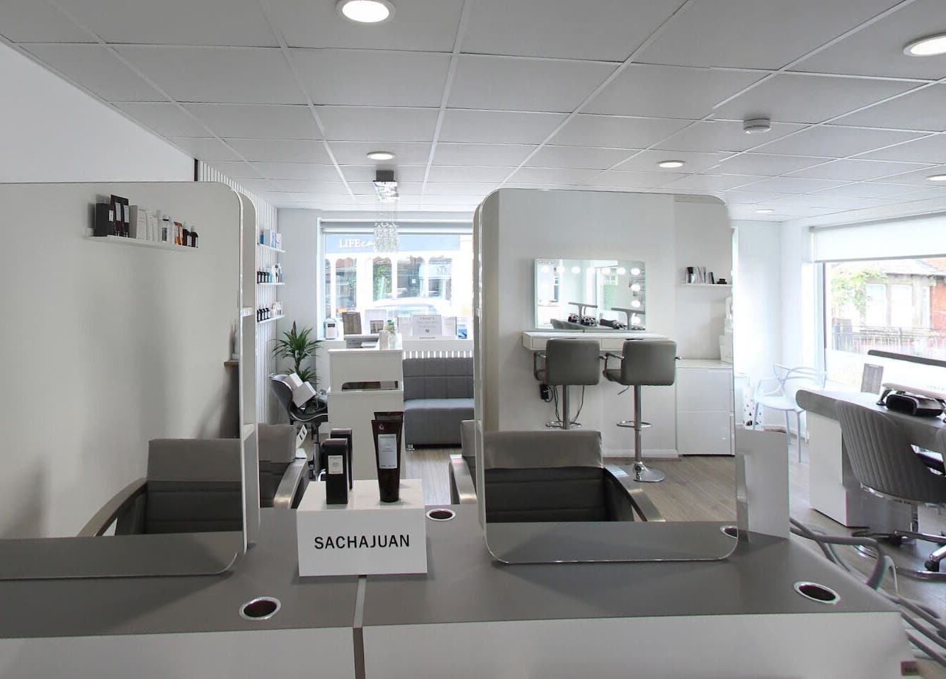Elegant interior of Prept Romiley beauty salon in Romiley, England, GB, featuring stylish chairs and mirrors.