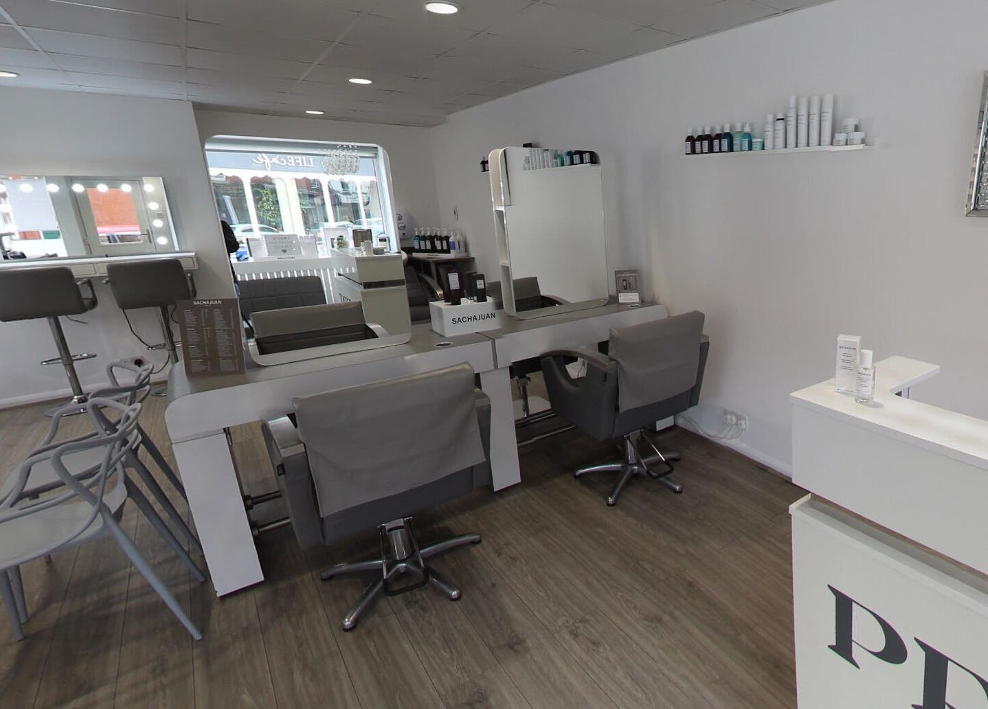 Chic interior of Prept Romiley beauty salon in Romiley, England, GB with stylish chairs and mirrors.
