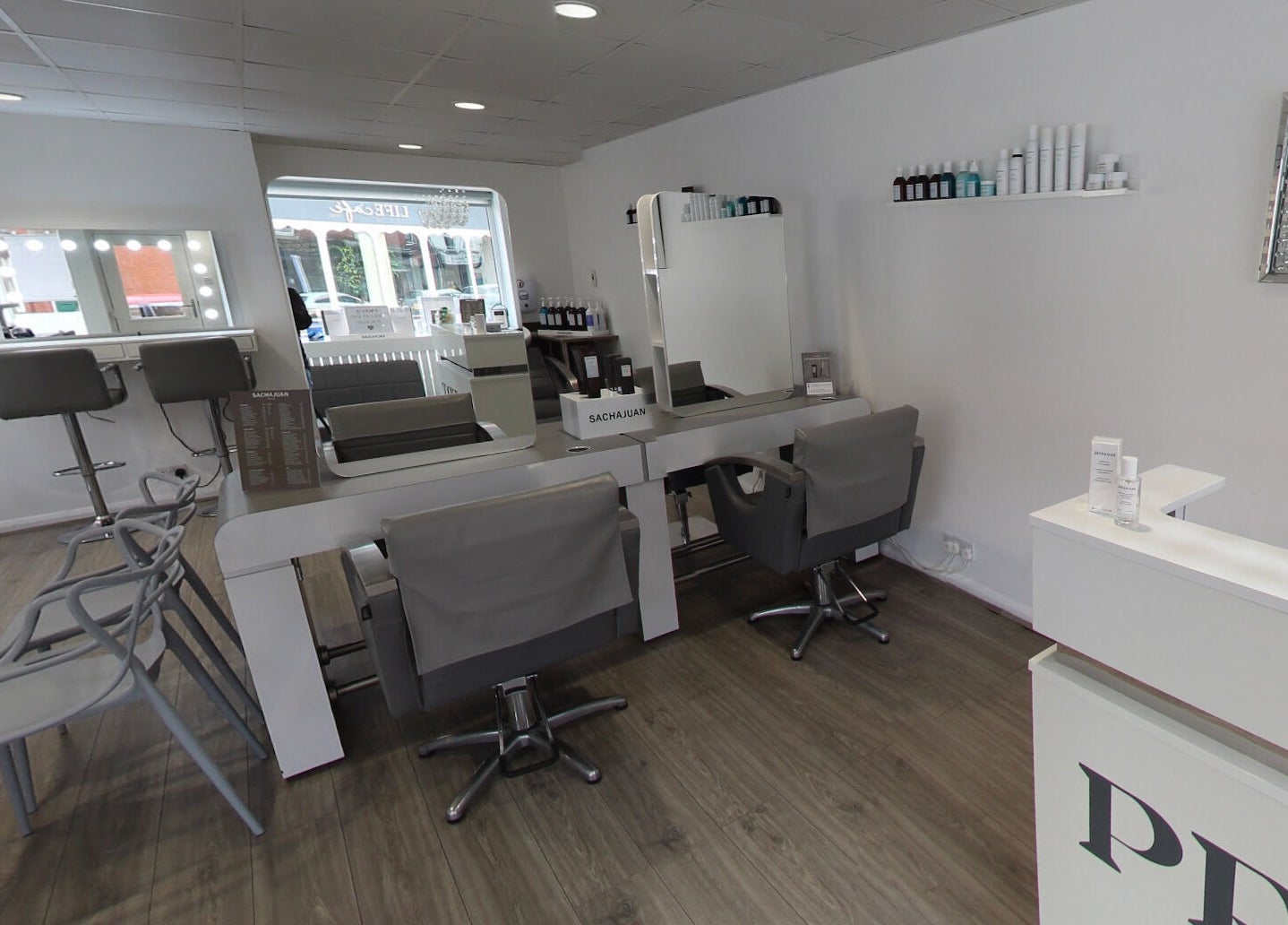 Chic interior of Prept Romiley beauty salon in Romiley, England, GB with stylish chairs and mirrors.