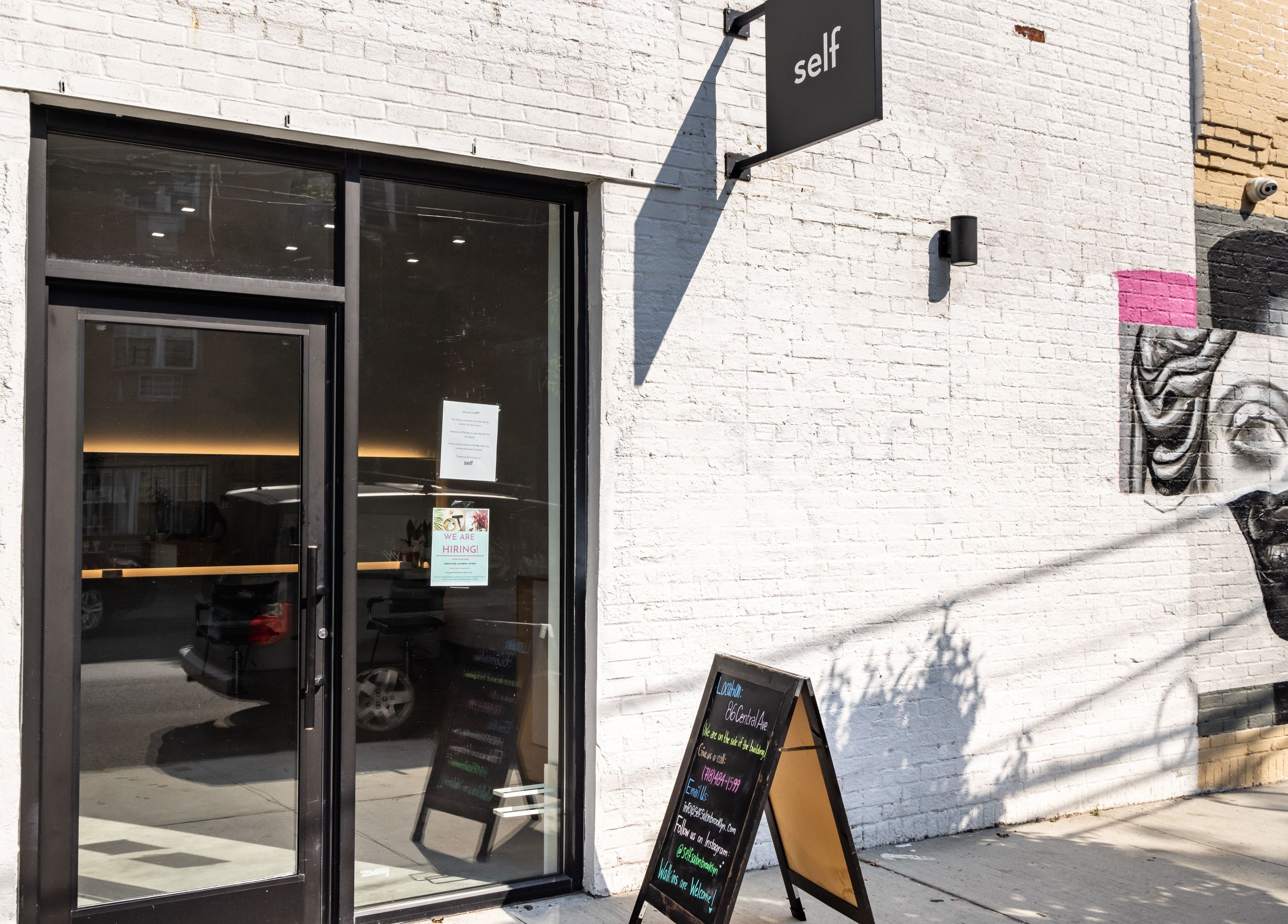 Entrance of Self Bushwick in New York, New York, US with modern art mural on a sunny day.