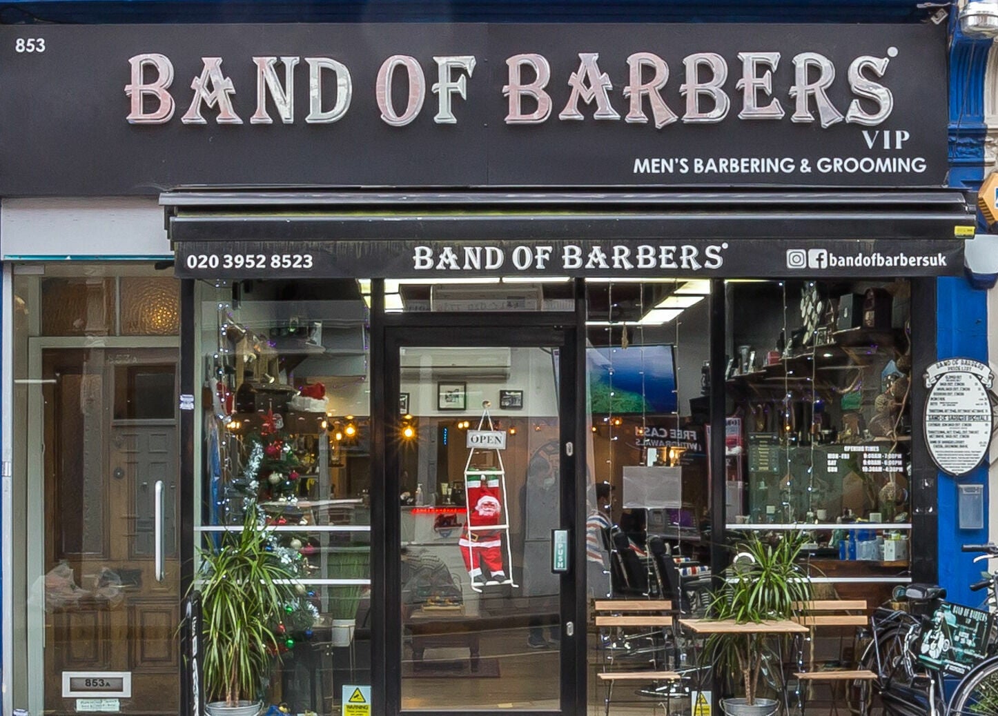 Front view of Band of Barbers VIP Fulham in London, England, GB displaying a modern barber shop entrance.