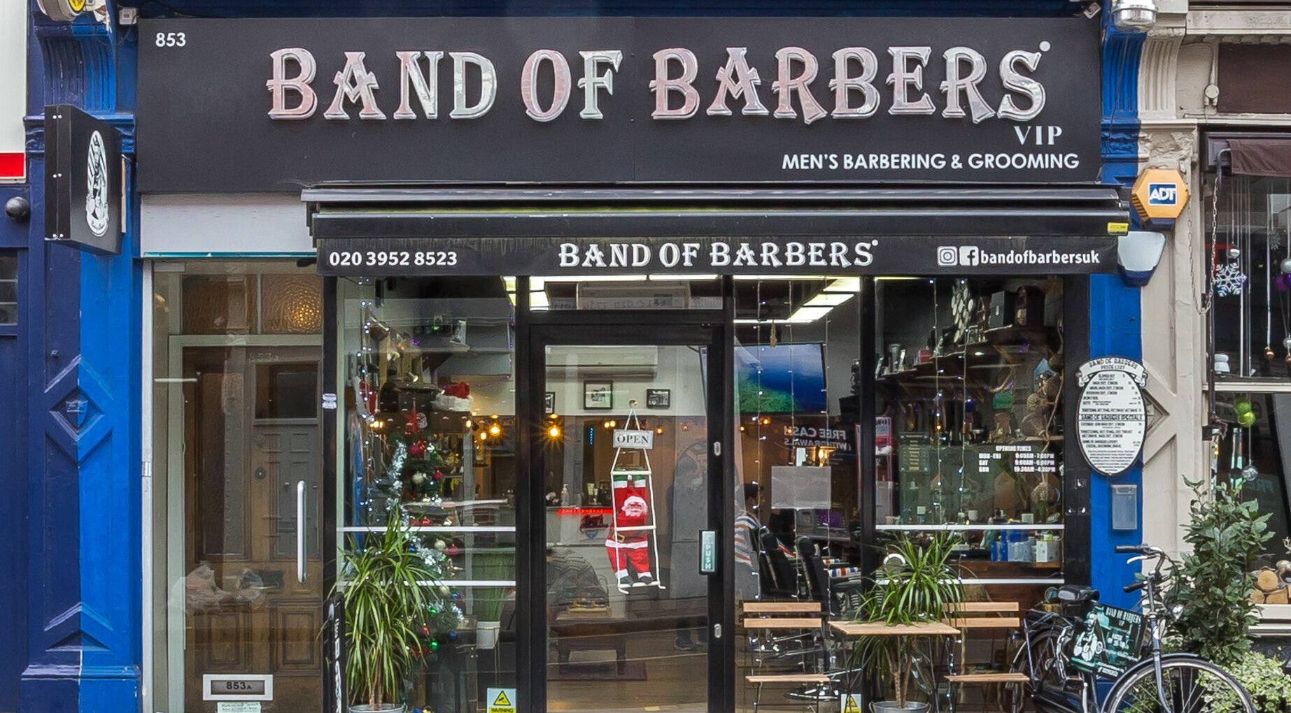 Front view of Band of Barbers VIP Fulham in London, England, GB displaying a modern barber shop entrance.