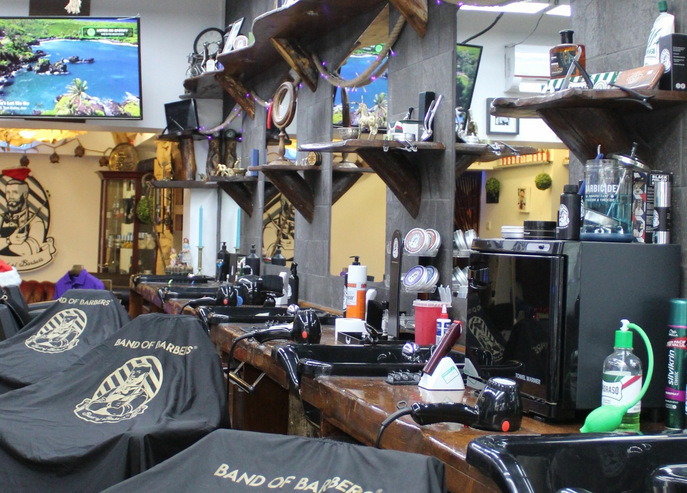 Interior of Band of Barbers VIP Fulham, showcasing stylish barber chairs and decor, London, England, GB.