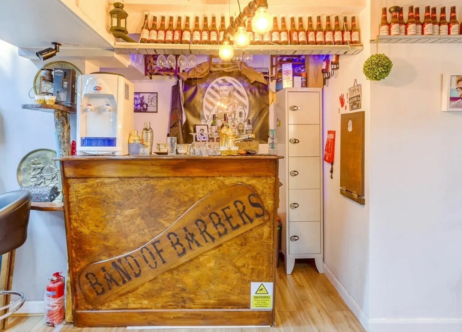 Cozy interior of Band of Barbers VIP Fulham with wooden decor in London, England, GB.
