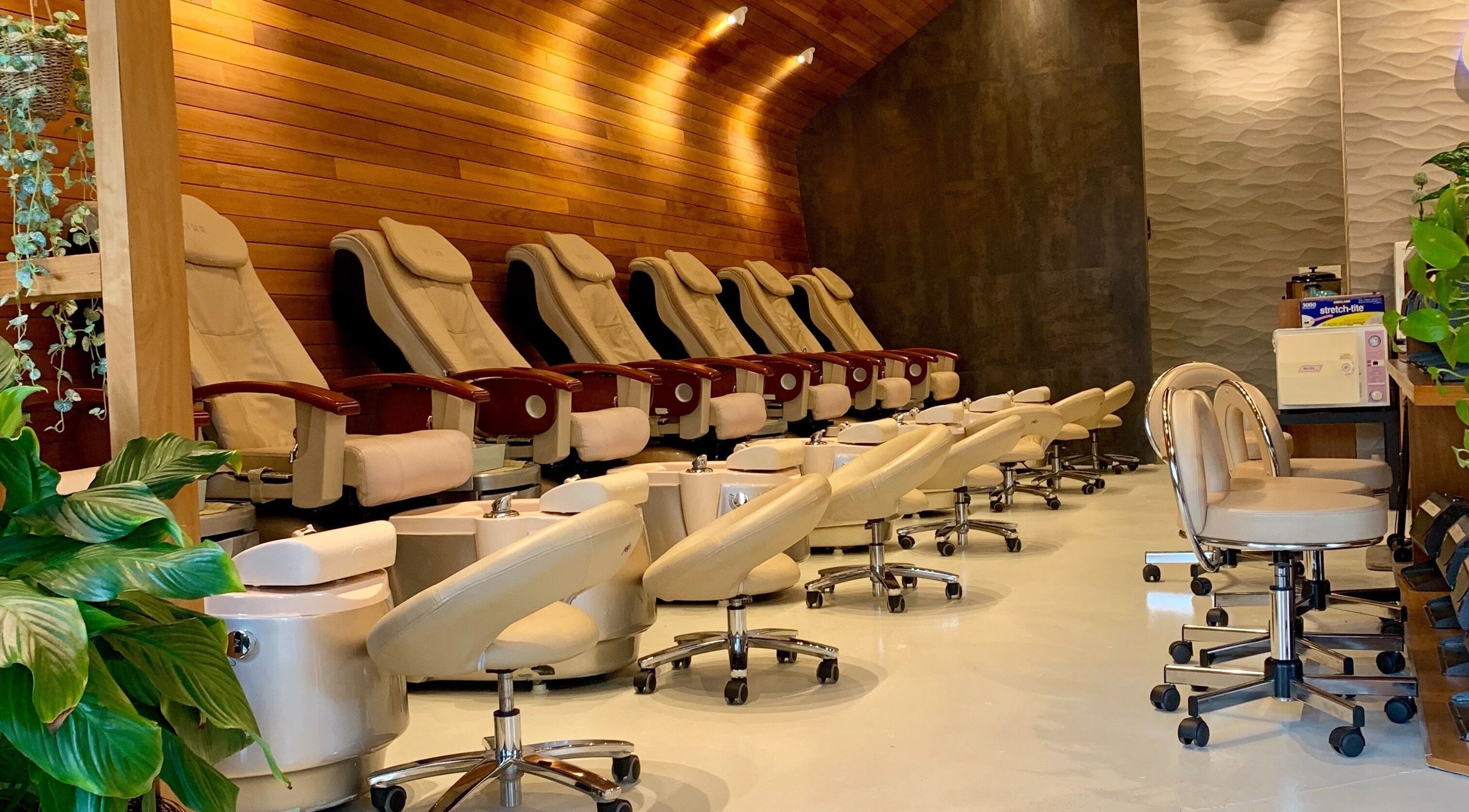 Splendid Nail and Spa's luxurious pedicure lounge at Fort Lee, New Jersey, US, featuring plush seating and decor.