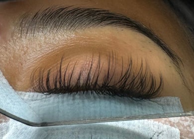 Close-up of expertly applied lashes at Lashaholicss, Toronto, Ontario, CA, showcasing sleek, full eyelashes.