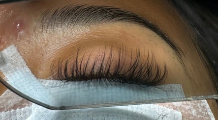 Close-up of expertly applied lashes at Lashaholicss, Toronto, Ontario, CA, showcasing sleek, full eyelashes.