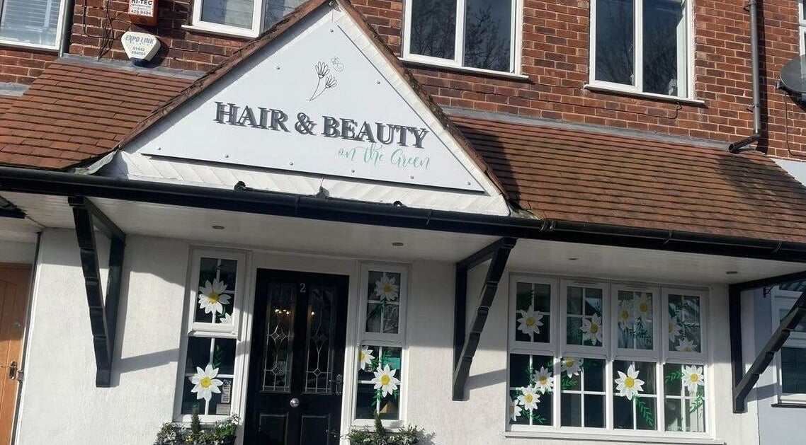 Exterior of Beauty on the Green located in Timperley, England, GB, featuring floral window decor.