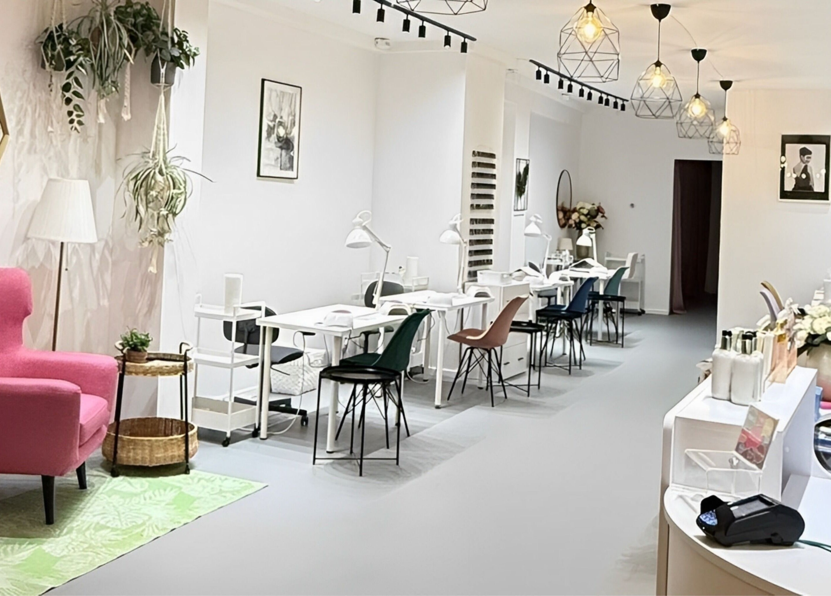 Modern chic interior of Endorphine Haarlem, featuring cozy chairs and sleek nail stations, in Haarlem, Noord-Holland, NL.