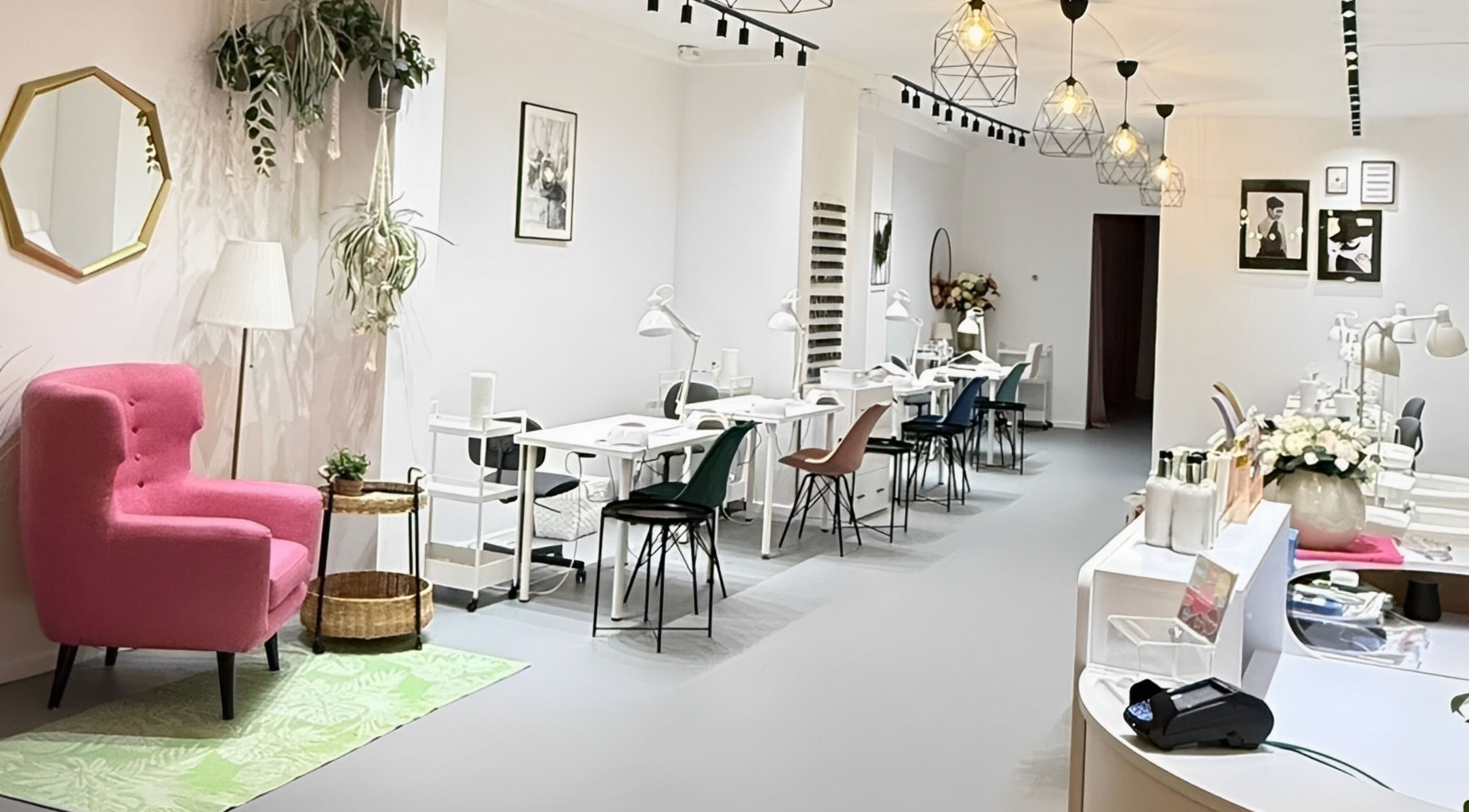 Modern chic interior of Endorphine Haarlem, featuring cozy chairs and sleek nail stations, in Haarlem, Noord-Holland, NL.