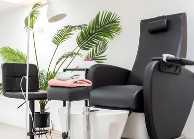 Luxurious pedicure chair at Endorphine Amsterdam, Amsterdam, Noord-Holland, NL, surrounded by lush greenery.