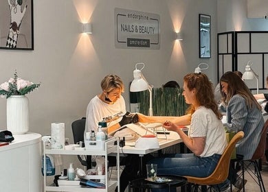 Endorphine Amsterdam nail salon interior with clients and staff, Amsterdam, Noord-Holland, NL.