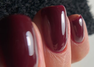 Close-up of elegant crimson nails at Endorphine Amsterdam, Amsterdam, Noord-Holland, NL.