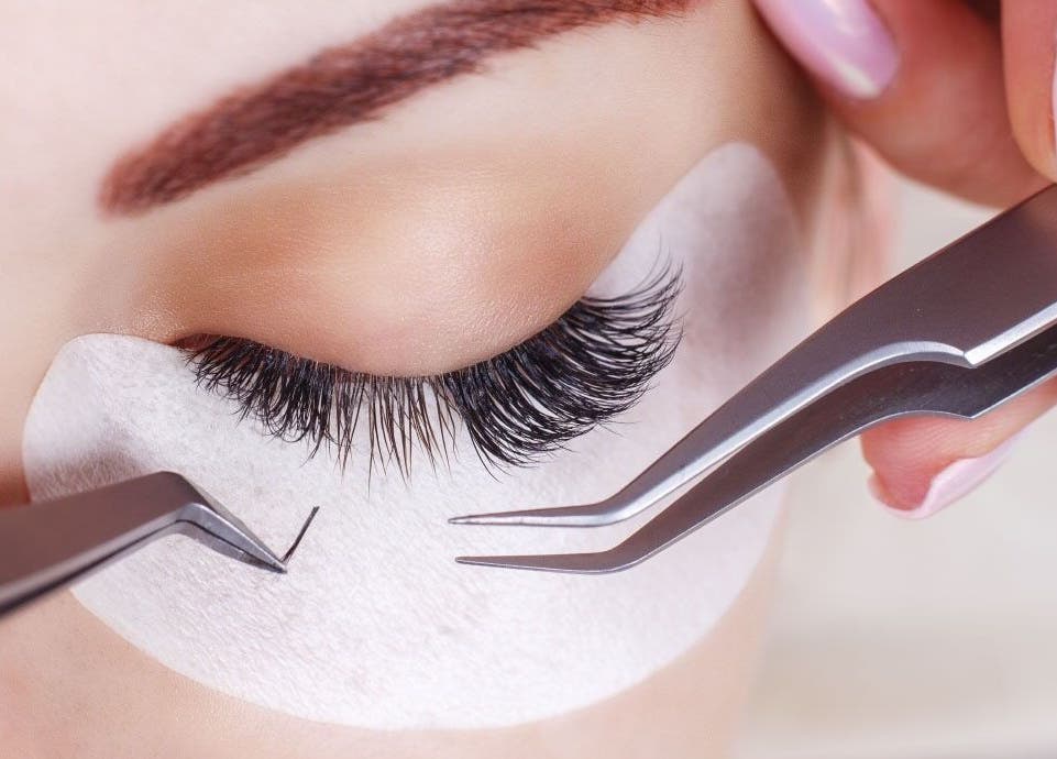 Lash extension process at Blo Out Beauty Bar - Home Service in Dubai, AE, highlighting precision and care.