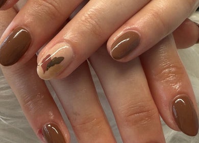 Stunning autumn-themed nails at Lushious Luxuries, Belfast, Northern Ireland, GB, showcasing elegant brown tones.