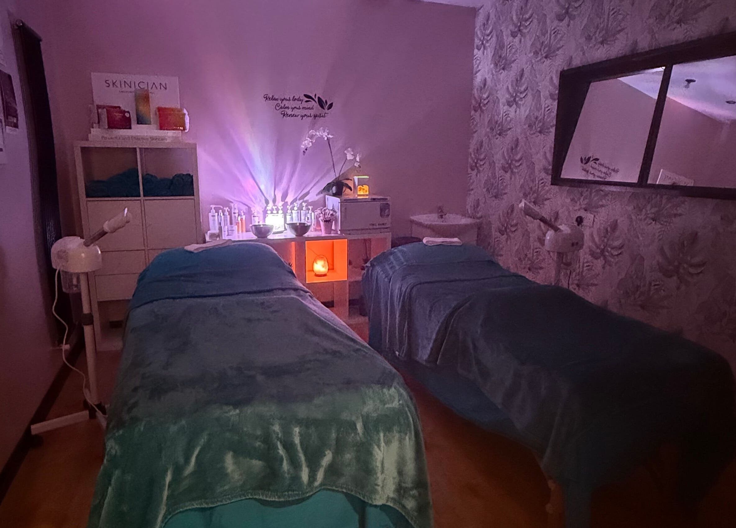 Relaxing therapy room at Lushious Luxuries Day Spa, Belfast, Northern Ireland, GB with soft lighting and treatment beds.