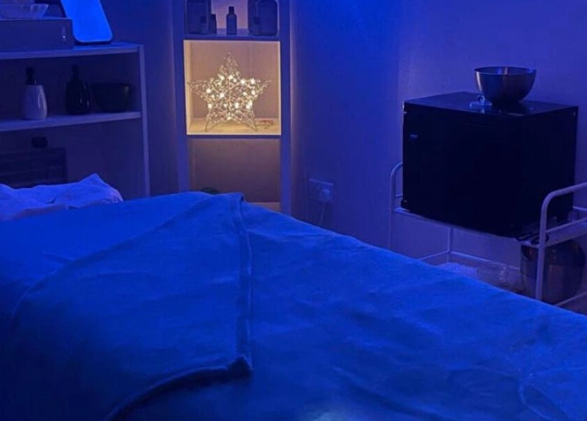 Relaxing massage room at Lushious Luxuries Day Spa, Belfast, Northern Ireland, GB, featuring soothing blue lighting.
