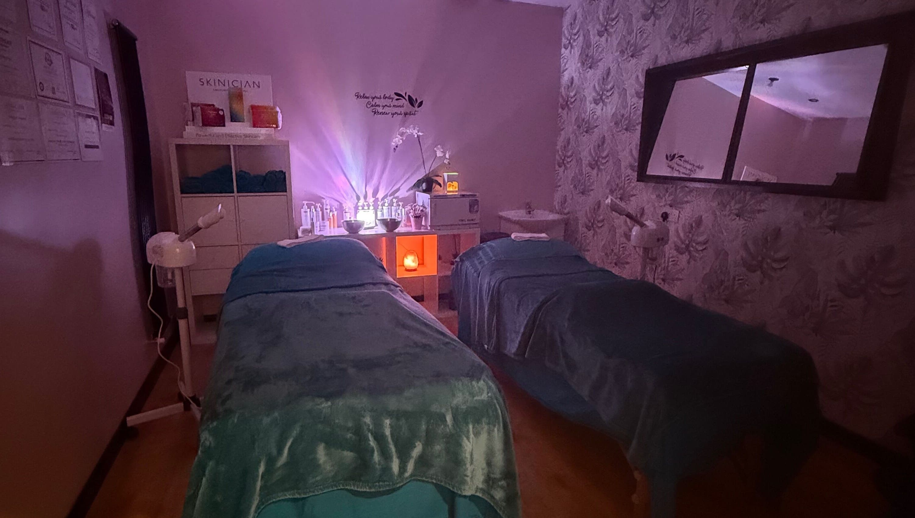 Cozy treatment room at Lushious Luxuries Day Spa, Belfast, Northern Ireland, GB, with dim lights and soft decor.