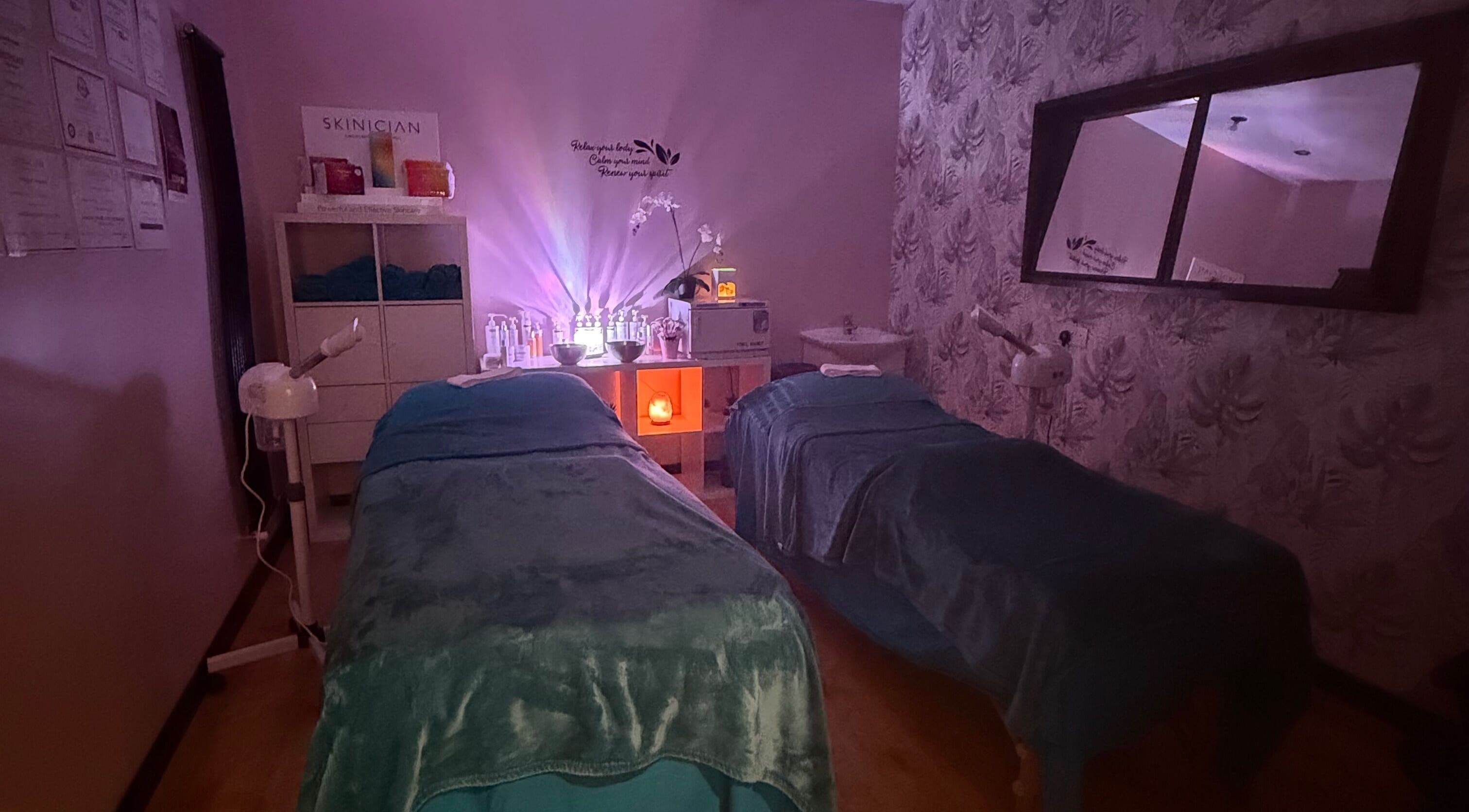 Cozy treatment room at Lushious Luxuries Day Spa, Belfast, Northern Ireland, GB, with dim lights and soft decor.