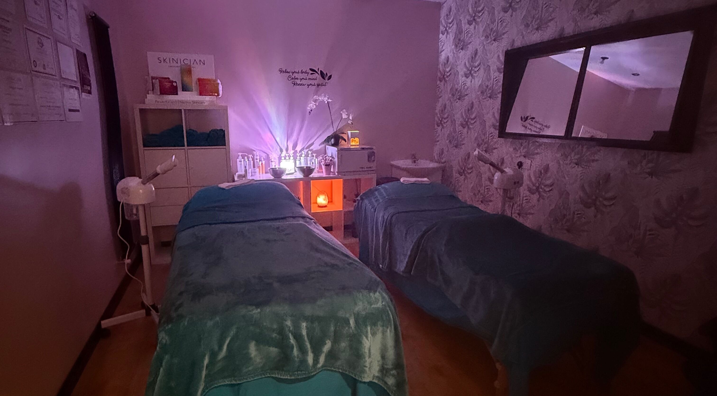 Cozy treatment room at Lushious Luxuries Day Spa, Belfast, Northern Ireland, GB, with dim lights and soft decor.