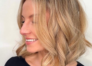 Elegant blonde hairstyle at Rob Hicks Salon, Cheltenham, England, GB, showcasing soft waves.
