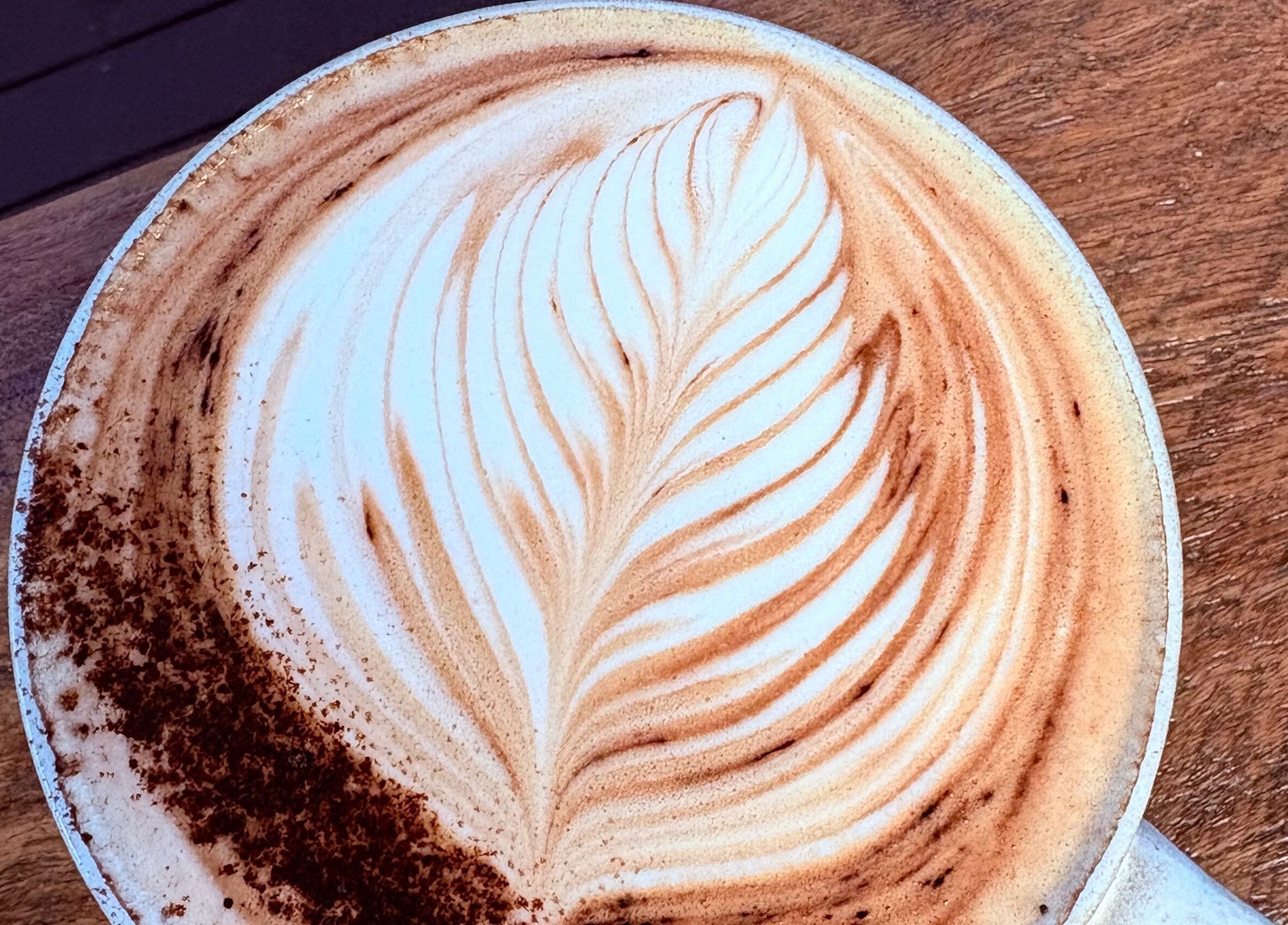 Creamy latte with elegant art at A Little Bit Pretty Beauty, Gin Gin, Queensland, AU.