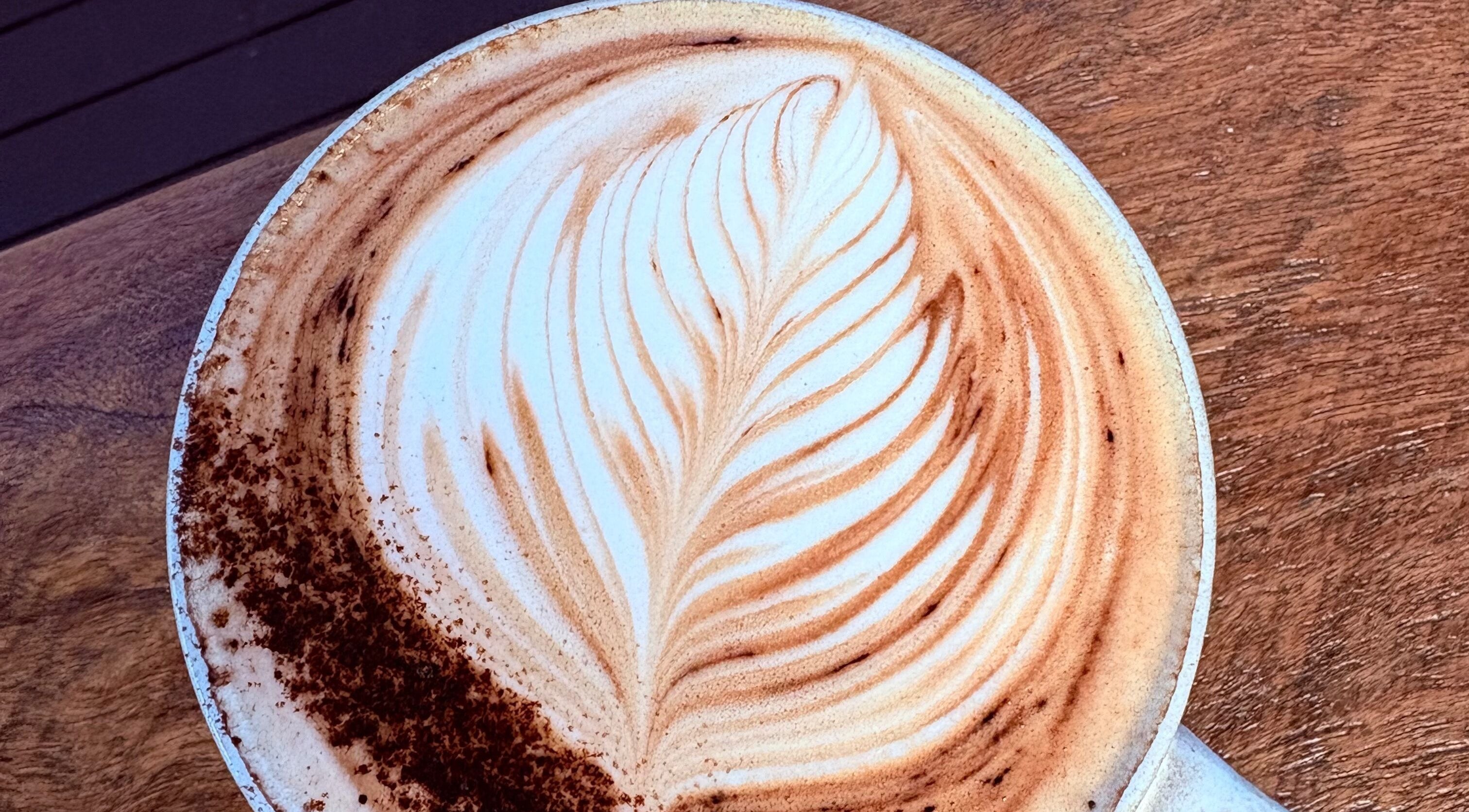 Creamy latte with elegant art at A Little Bit Pretty Beauty, Gin Gin, Queensland, AU.