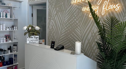 Reception area with products and neon sign at Elisha Marie Skin & Body, Palo Alto, California, US.