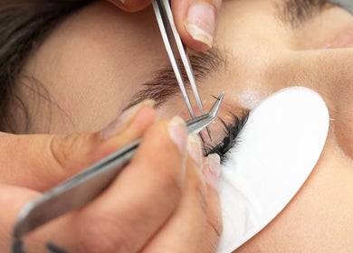 Expert applying eyelash extensions at Elisha Marie Skin & Body in Palo Alto, California, US.