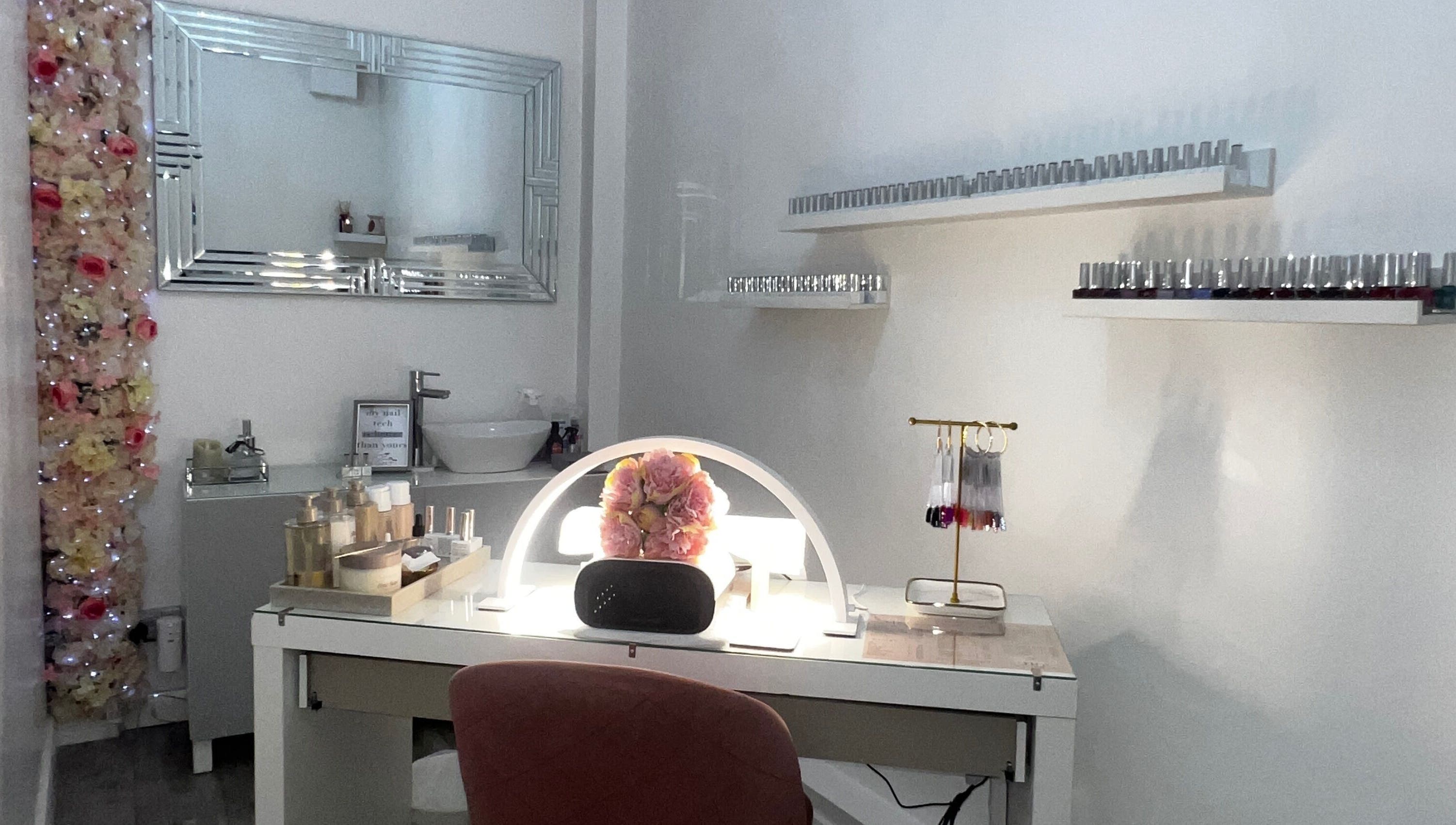 Elegant nail station at Salon Twenty9 in Kimberley, England, GB with decor and nail polish collection.