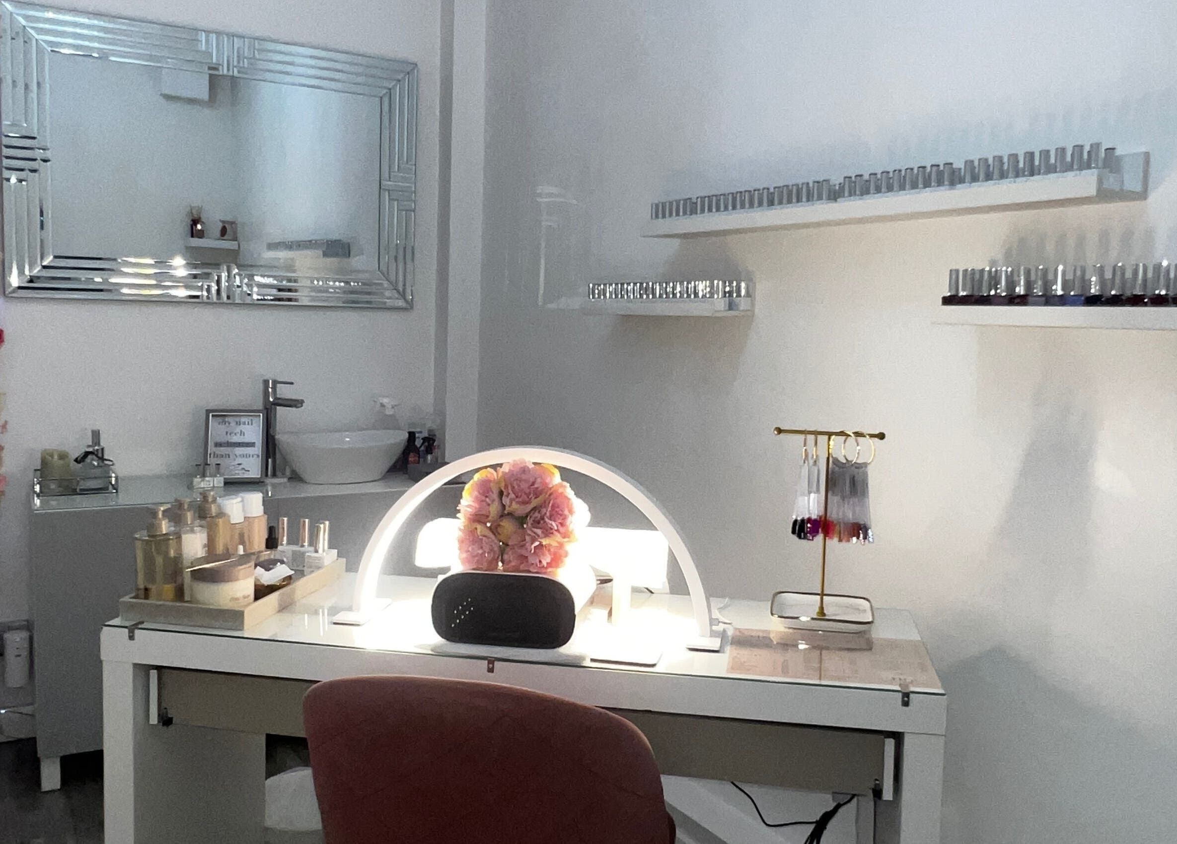 Elegant nail station at Salon Twenty9 in Kimberley, England, GB with decor and nail polish collection.