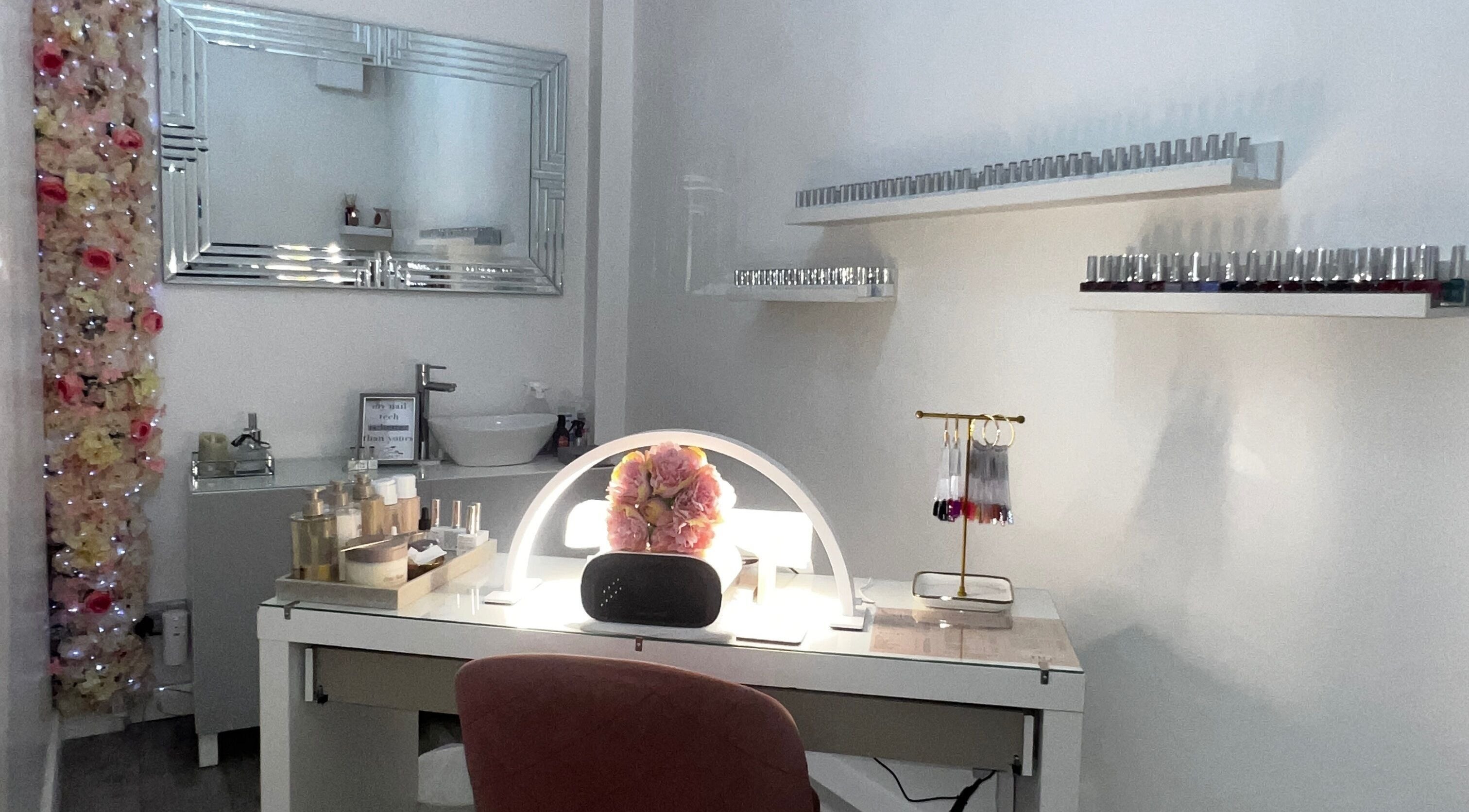 Elegant nail station at Salon Twenty9 in Kimberley, England, GB with decor and nail polish collection.