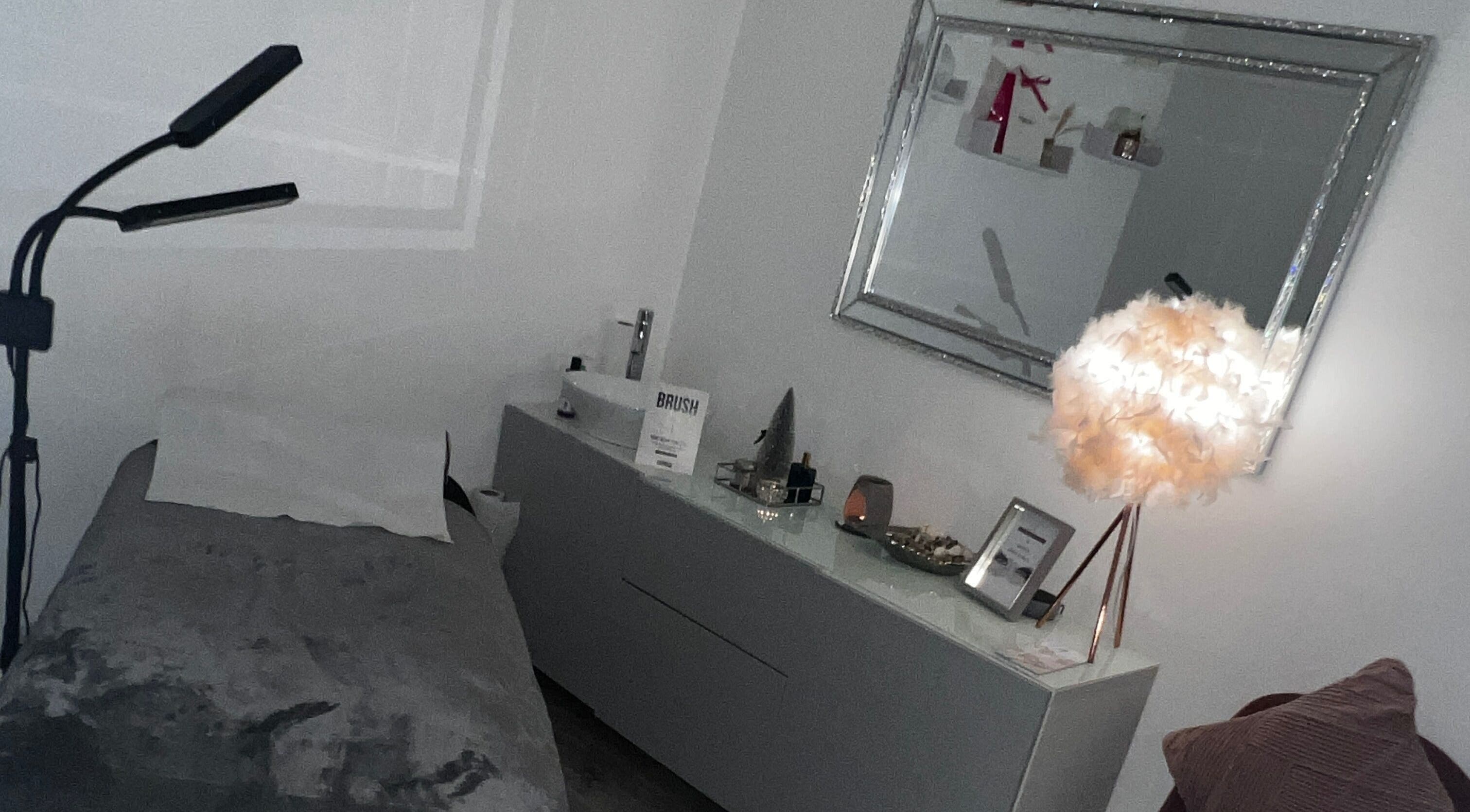 Cozy treatment room at Salon Twenty9, Kimberley, England, GB with a plush bed and stylish lamp.