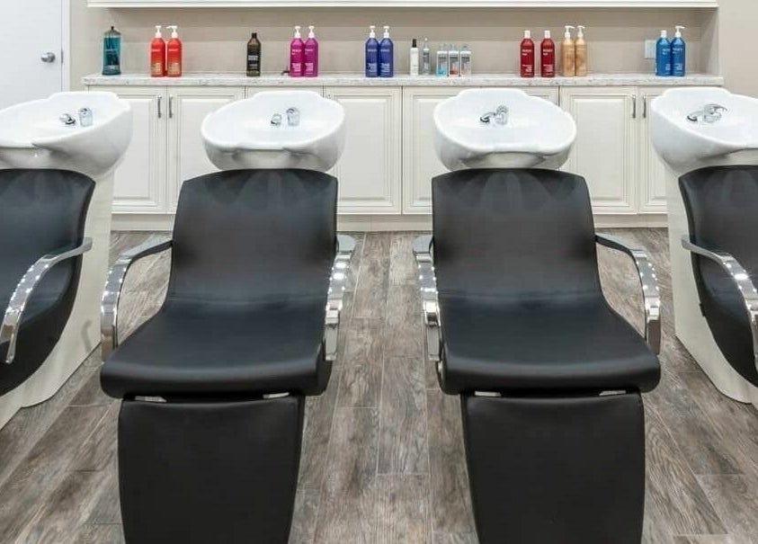 Luxurious shampoo stations at Foiled Salon and Spa in Cambridge, Ontario, CA, offering comfort and style.