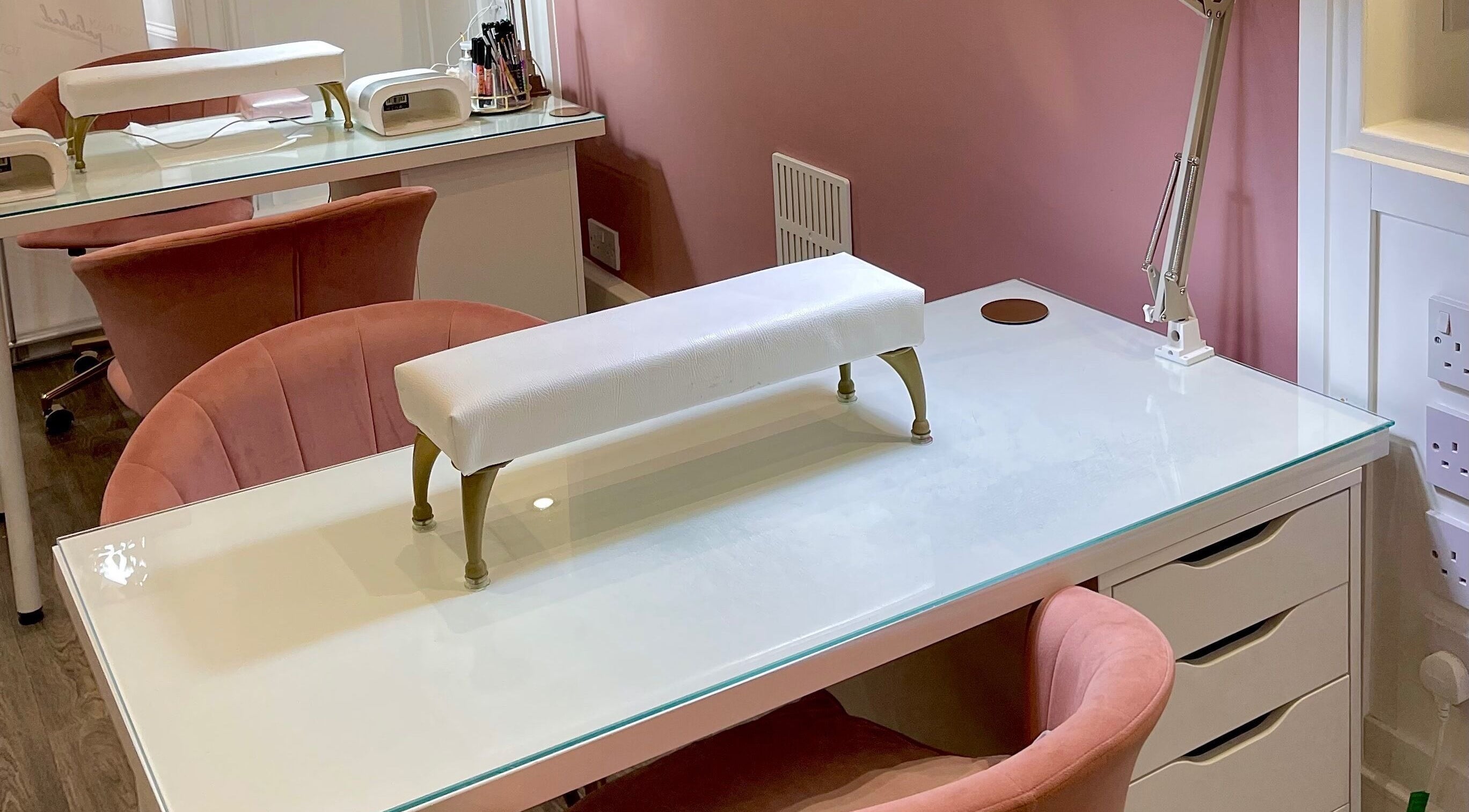 Elegant manicure setup at Totally Polished Tadcaster, Tadcaster, England, GB with plush seating.