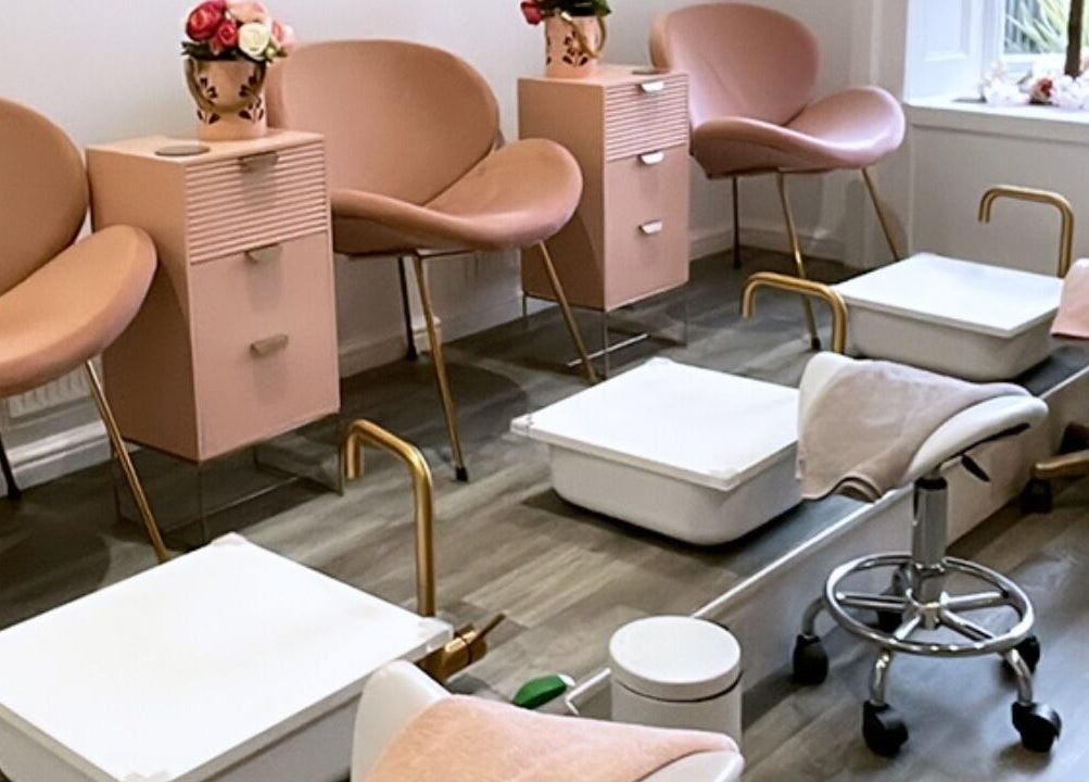 Elegant pedicure area at Totally Polished Tadcaster, Tadcaster, England, GB with blush pink chairs and foot baths.