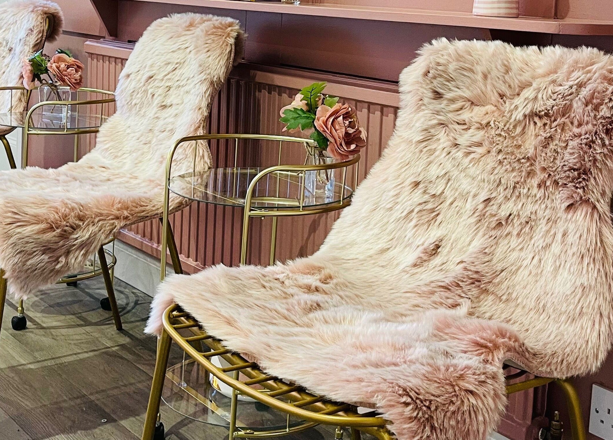 Elegant fur-adorned chairs at Totally Polished Tadcaster, Tadcaster, England, GB enhancing aesthetic appeal.