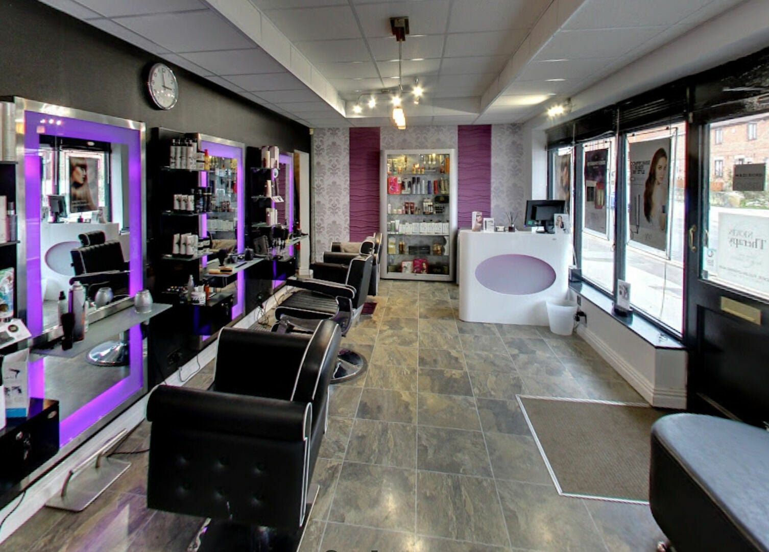 Stylish salon interior at Masson's, Maltby, England, GB showcasing modern decor and beauty products.