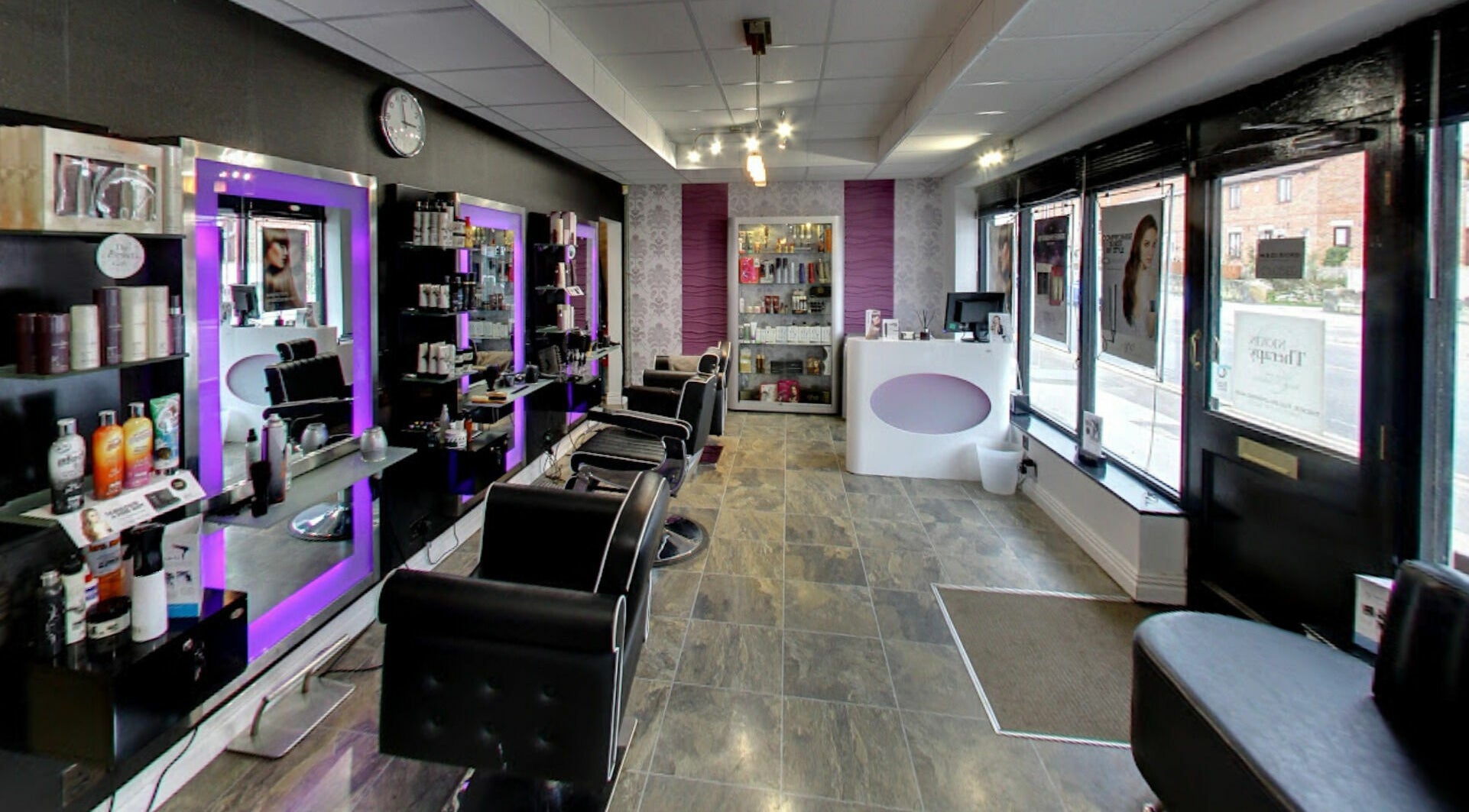 Stylish salon interior at Masson's, Maltby, England, GB showcasing modern decor and beauty products.