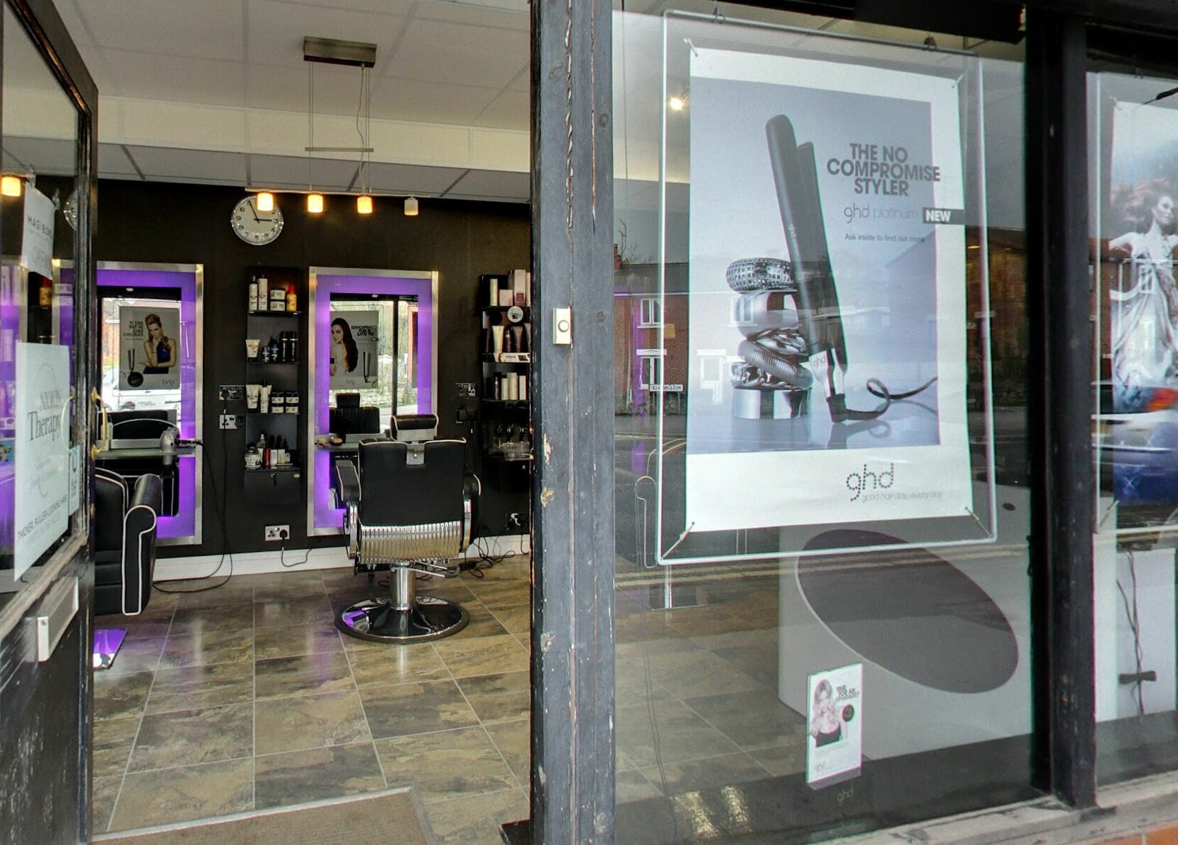 Masson's chic interior view from the entrance in Maltby, England, GB, showcasing modern salon chairs and mirrors.