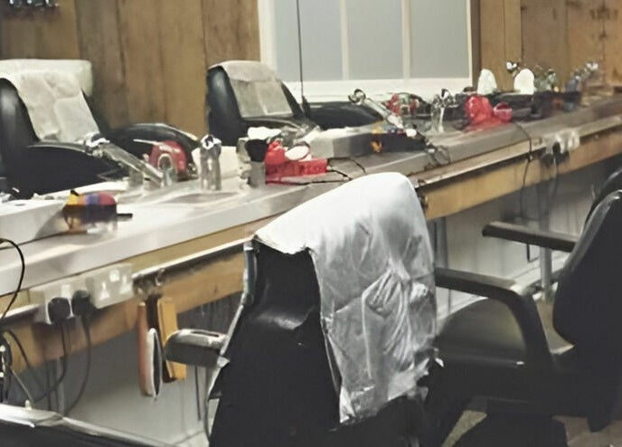 Vintage barber chairs at Chapps Barbershop in Southwold, England, GB highlight traditional grooming atmosphere.