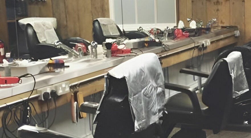 Vintage barber chairs at Chapps Barbershop in Southwold, England, GB highlight traditional grooming atmosphere.