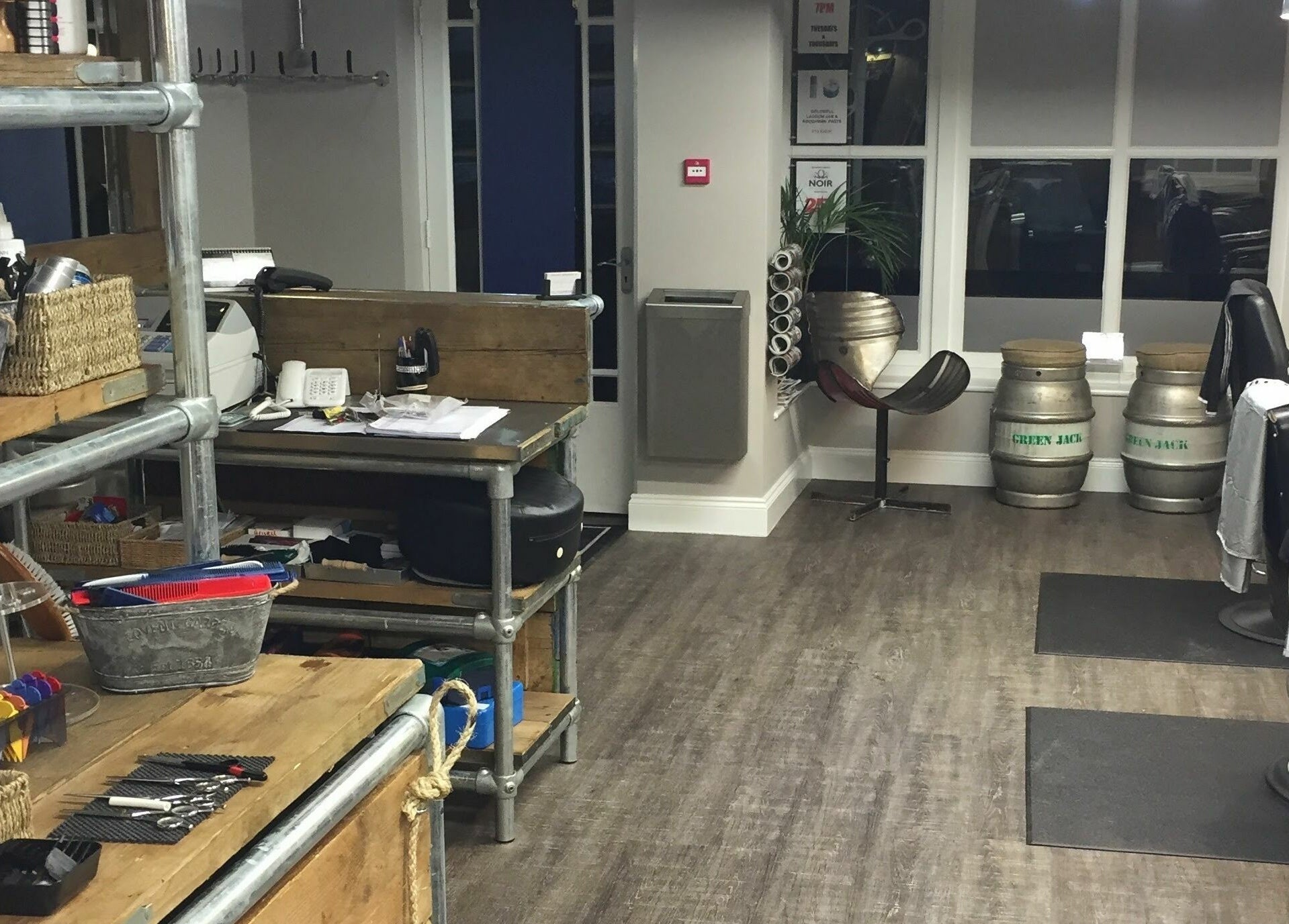 Cozy interior of Chapps Barbershop in Southwold, England, GB showcasing stylish barber chairs and rustic decor.