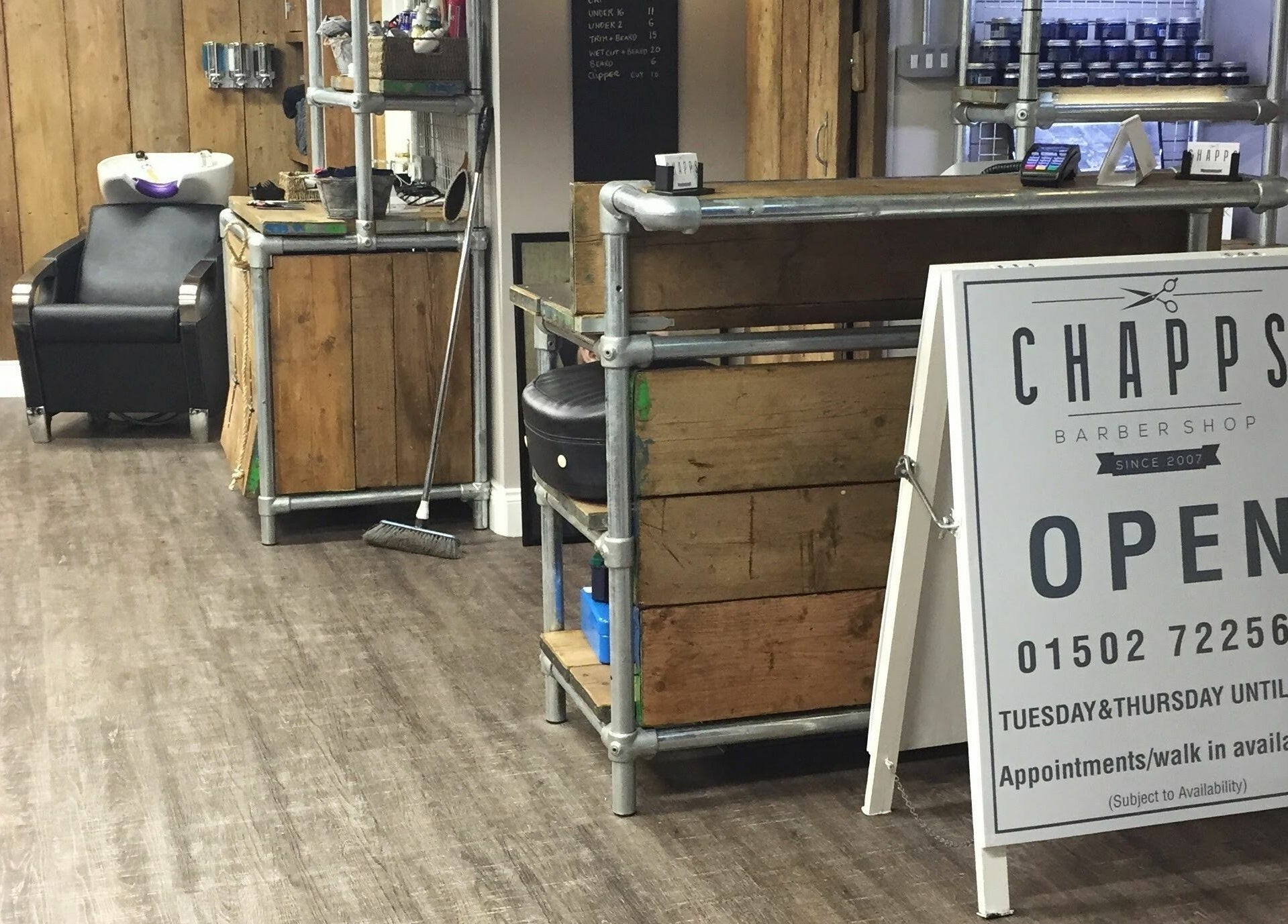Chapps Barbershop interior with rustic wooden decor in Southwold, England, GB.