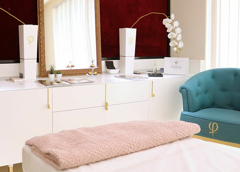 Elegant treatment room with plush chair at Phi Studio Dubai, Dubai, Dubai, AE, offering a tranquil ambiance.