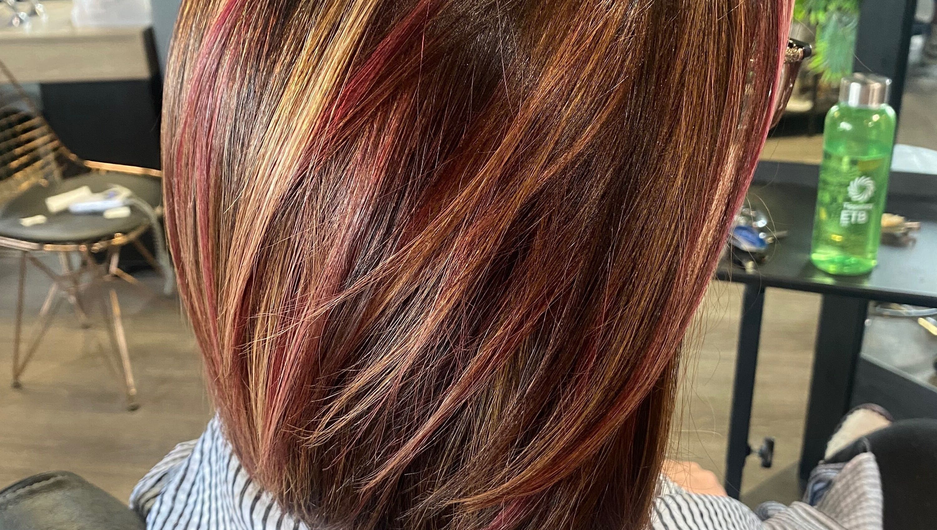 Vibrant hair highlights captured at The Grand Salon, Cahir, County Tipperary, IE, showcasing expert styling.